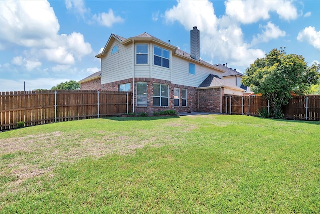 3501 Thorp Springs Dr, Plano, TX 75025 - back of property with brick siding and a chimney
