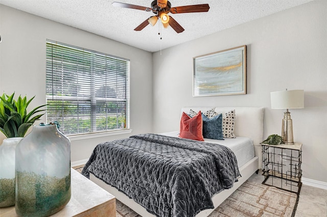 3501 Thorp Springs Dr, Plano, TX 75025 - bedroom featuring baseboards, a textured ceiling, and a ceiling fan