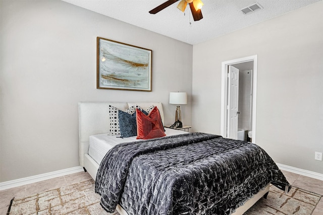 3501 Thorp Springs Dr, Plano, TX 75025 - bedroom with baseboards, light tile patterned flooring, a textured ceiling, and a ceiling fan