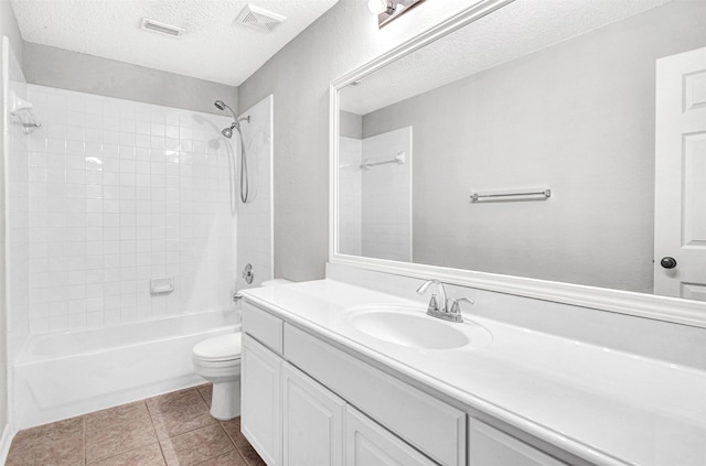 3501 Thorp Springs Dr, Plano, TX 75025 - full bath with a textured ceiling, toilet, vanity, tub / shower combination, and tile patterned flooring