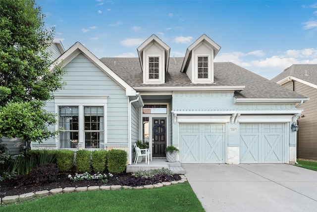 2307 Grizzly Run Ln, Euless, TX 76039 - view of front of house with driveway, a garage, and a shingled roof