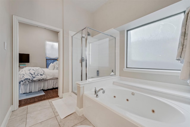 2307 Grizzly Run Ln, Euless, TX 76039 - full bathroom featuring a shower stall, connected bathroom, a tub with jets, tile patterned floors, and baseboards