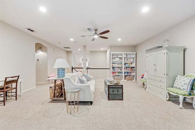 2307 Grizzly Run Ln, Euless, TX 76039 - living room featuring ceiling fan, carpet flooring, recessed lighting, baseboards, and arched walkways