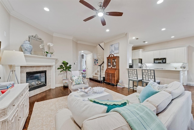 2307 Grizzly Run Ln, Euless, TX 76039 - living area with ceiling fan, stairway, arched walkways, recessed lighting, and dark wood-style floors