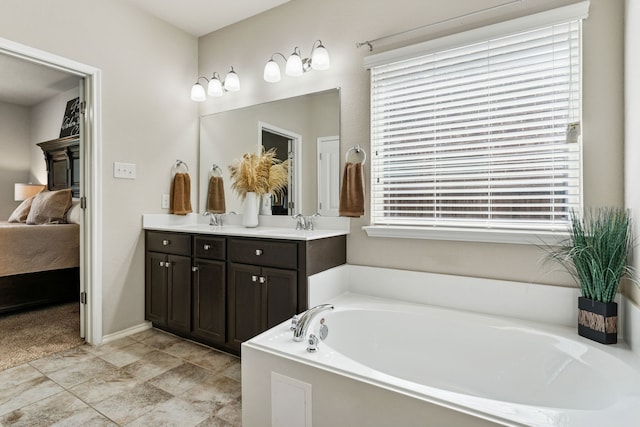 9812 Beaver Dam Ln, Mckinney, TX 75071 - bathroom featuring ensuite bathroom, a bath, and double vanity