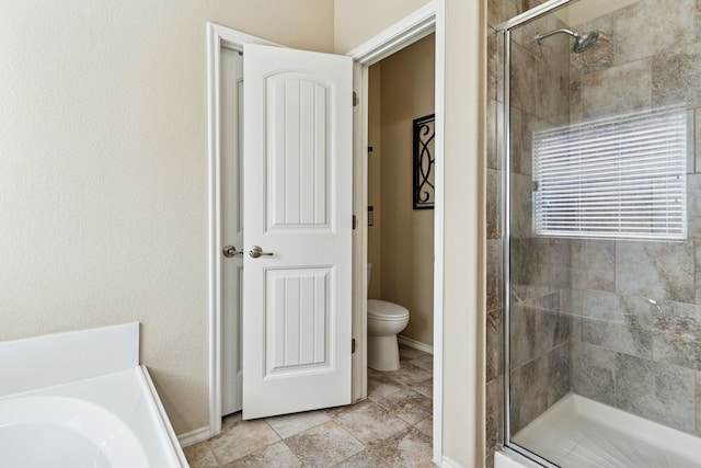 9812 Beaver Dam Ln, Mckinney, TX 75071 - bathroom featuring toilet, a stall shower, a bath, and baseboards