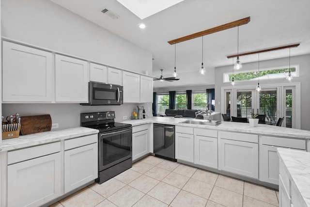 713 Bridle Trl, Saginaw, TX 76179 - kitchen with appliances with stainless steel finishes, a sink, light tile patterned flooring, white cabinetry, and recessed lighting