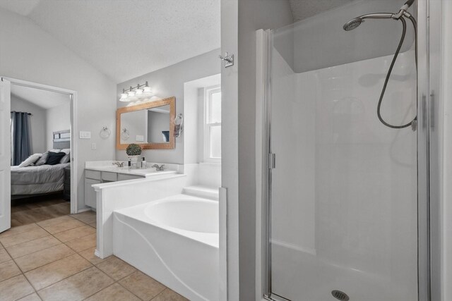713 Bridle Trl, Saginaw, TX 76179 - bathroom featuring vaulted ceiling, a shower stall, tile patterned flooring, vanity, and connected bathroom