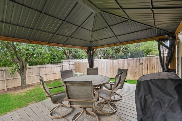 713 Bridle Trl, Saginaw, TX 76179 - wooden deck with a fenced backyard, outdoor dining area, and area for grilling