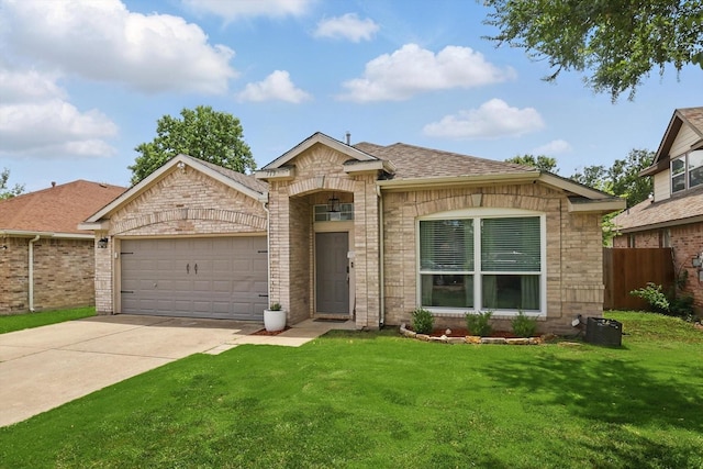 713 Bridle Trl, Saginaw, TX 76179 - view of front of home featuring a garage, driveway, roof with shingles, and brick siding