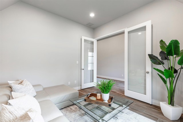 8808 Navidad Falls Dr, Mckinney, TX 75071 - living room featuring french doors, wood finished floors, baseboards, and recessed lighting