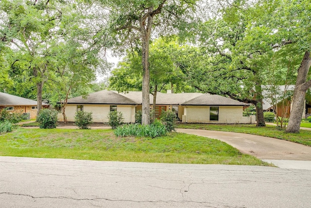 2317 Vega St, Grand Prairie, TX 75050 - mid-century inspired home featuring driveway and a front yard