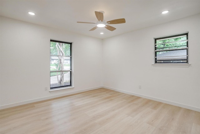 2317 Vega St, Grand Prairie, TX 75050 - spare room featuring plenty of natural light, wood finished floors, recessed lighting, and a ceiling fan