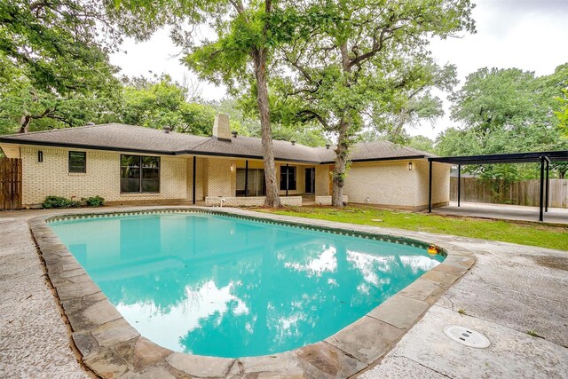 2317 Vega St, Grand Prairie, TX 75050 - view of swimming pool with a fenced backyard and a patio