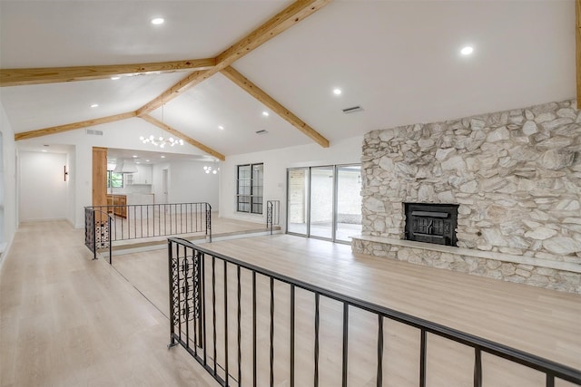 2317 Vega St, Grand Prairie, TX 75050 - unfurnished living room featuring wood finished floors, a stone fireplace, and recessed lighting