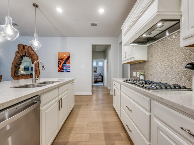 217 Fulton St, Oak Point, TX 75068 - kitchen with appliances with stainless steel finishes, a sink, premium range hood, decorative backsplash, and baseboards