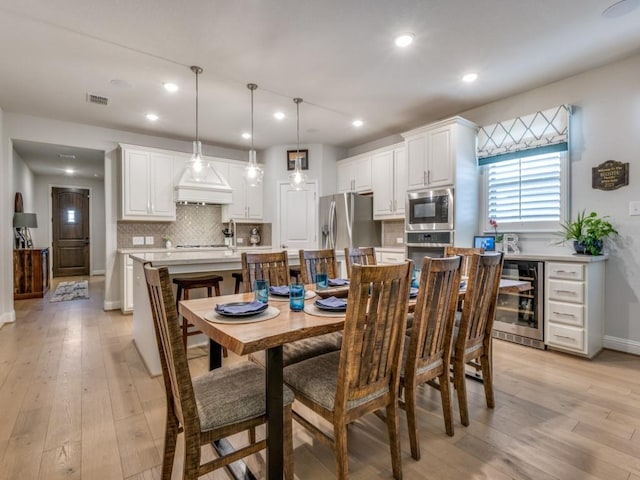 217 Fulton St, Oak Point, TX 75068 - dining space featuring wine cooler, light wood-type flooring, recessed lighting, and baseboards