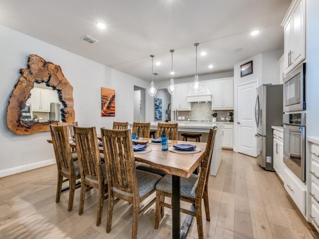 217 Fulton St, Oak Point, TX 75068 - dining space with light wood-type flooring, recessed lighting, and baseboards