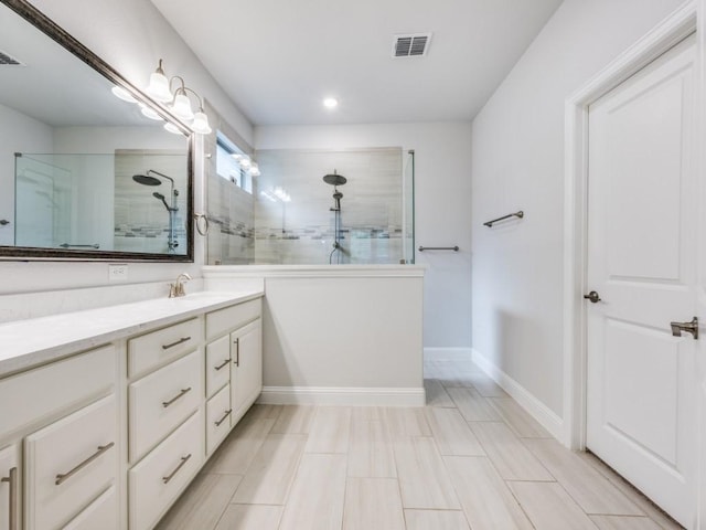 217 Fulton St, Oak Point, TX 75068 - bathroom with walk in shower, vanity, baseboards, and recessed lighting