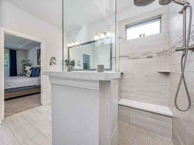 217 Fulton St, Oak Point, TX 75068 - ensuite bathroom featuring a walk in shower, tile patterned flooring, and vanity