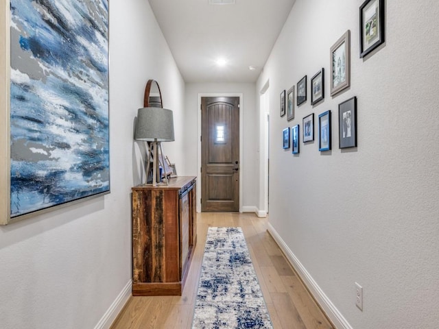 217 Fulton St, Oak Point, TX 75068 - doorway with light wood-style floors and baseboards