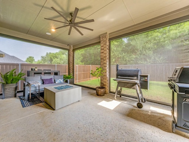 217 Fulton St, Oak Point, TX 75068 - sunroom / solarium featuring a fire pit, ceiling fan, and an outdoor kitchen