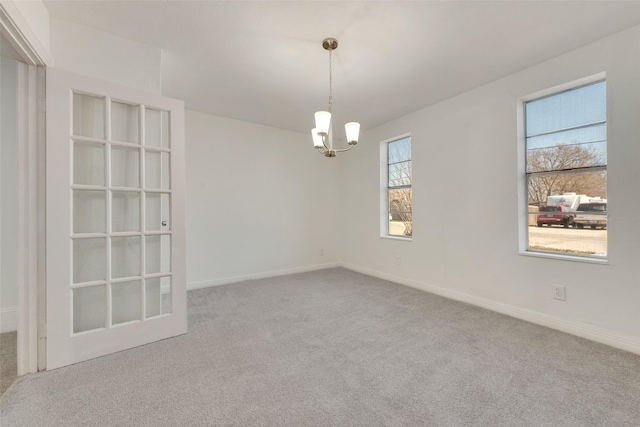 129 Western Ave, Saginaw, TX 76179 - carpeted empty room with a chandelier and baseboards