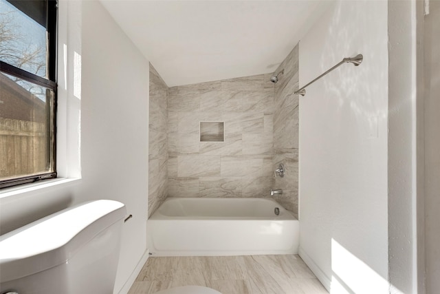 129 Western Ave, Saginaw, TX 76179 - bathroom with toilet, bathing tub / shower combination, and baseboards