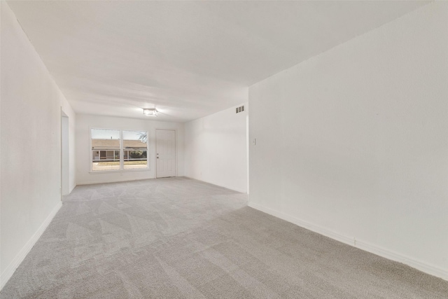129 Western Ave, Saginaw, TX 76179 - unfurnished room with light carpet and baseboards