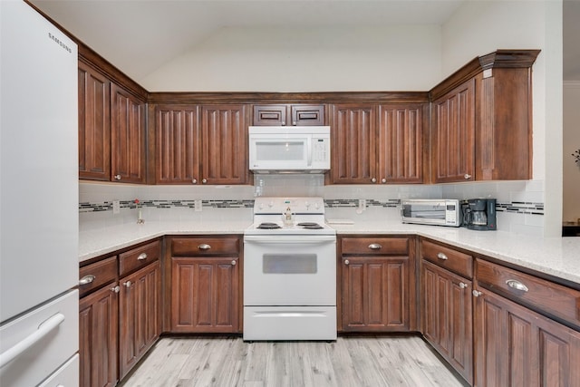 6729 Lucas Ln, North Richland Hills, TX 76182 - kitchen with white appliances, tasteful backsplash, lofted ceiling, and light wood-type flooring