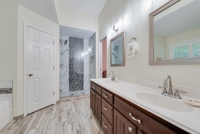 6729 Lucas Ln, North Richland Hills, TX 76182 - full bath featuring a stall shower, double vanity, a bath, and wood finished floors