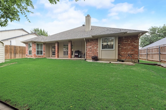 6729 Lucas Ln, North Richland Hills, TX 76182 - rear view of property featuring a chimney, brick siding, a patio, and roof with shingles