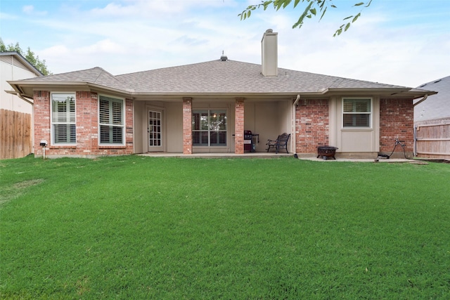 6729 Lucas Ln, North Richland Hills, TX 76182 - back of property with a chimney, brick siding, roof with shingles, and a patio area