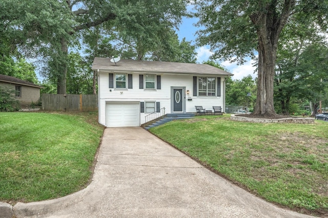 bi-level home with driveway and an attached garage