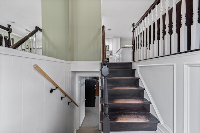 stairs featuring concrete floors
