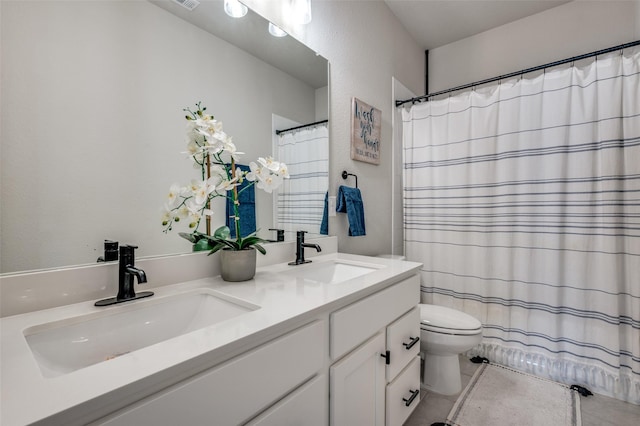 1408 Arrowwood Dr, Aubrey, TX 76227 - full bath featuring double vanity, tile patterned flooring, toilet, and a shower with shower curtain