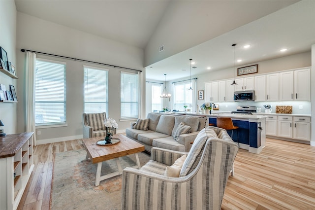 1408 Arrowwood Dr, Aubrey, TX 76227 - living area featuring light wood-type flooring, recessed lighting, a chandelier, and vaulted ceiling