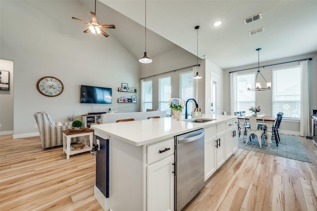 1408 Arrowwood Dr, Aubrey, TX 76227 - kitchen featuring dishwasher, a sink, light wood-type flooring, a kitchen island with sink, and baseboards