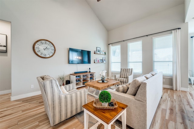 1408 Arrowwood Dr, Aubrey, TX 76227 - living room with baseboards, light wood-style floors, and high vaulted ceiling