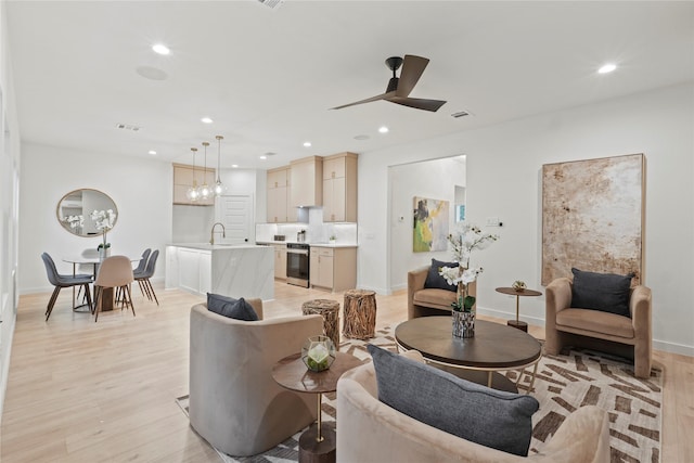 2508 Kool Ave, Dallas, TX 75241 - living room with light wood-type flooring, ceiling fan, baseboards, and recessed lighting
