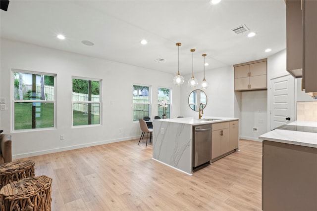 2508 Kool Ave, Dallas, TX 75241 - kitchen with dishwasher, recessed lighting, light wood-style flooring, decorative light fixtures, and light stone counters