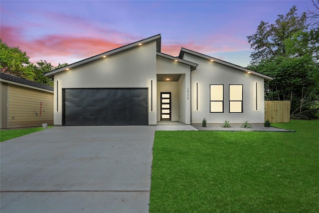 2508 Kool Ave, Dallas, TX 75241 - contemporary home with concrete driveway, a garage, and stucco siding