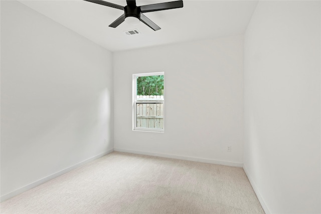 2508 Kool Ave, Dallas, TX 75241 - spare room with light colored carpet, baseboards, and a ceiling fan