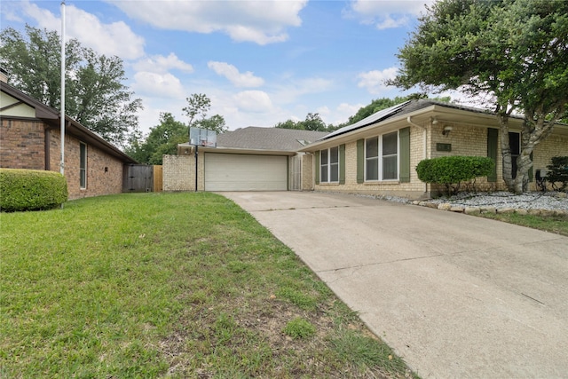 4701 Yellowleaf Dr, Fort Worth, TX 76133 - view of front of house with brick siding, driveway, solar panels, and an attached garage
