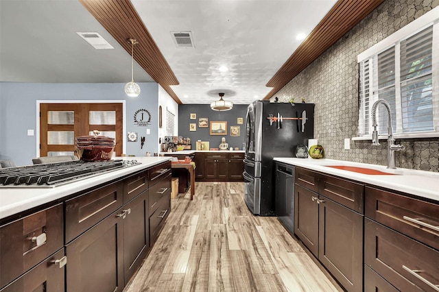 1225 Oak Meadows Dr, Dallas, TX 75232 - kitchen with appliances with stainless steel finishes and light countertops