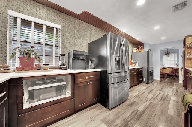 1225 Oak Meadows Dr, Dallas, TX 75232 - kitchen with stainless steel appliances, recessed lighting, light wood finished floors, baseboards, and wallpapered walls