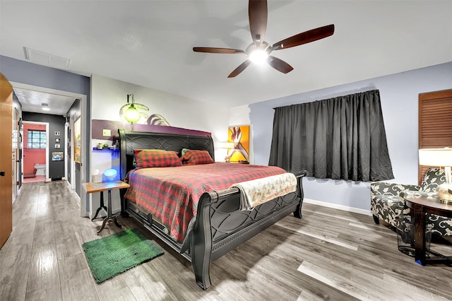 1225 Oak Meadows Dr, Dallas, TX 75232 - bedroom featuring wood finished floors, baseboards, and ceiling fan