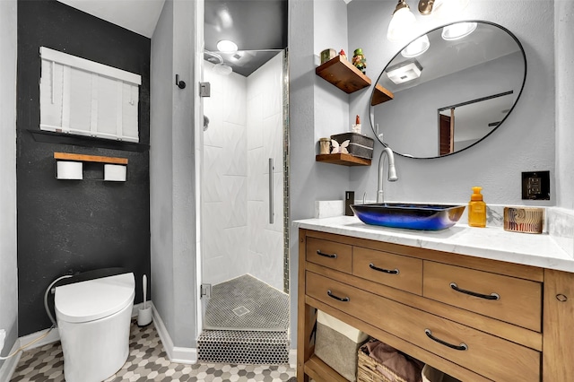 1225 Oak Meadows Dr, Dallas, TX 75232 - full bathroom with a shower stall, baseboards, vanity, toilet, and tile patterned flooring