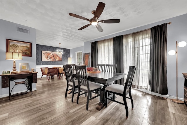 1225 Oak Meadows Dr, Dallas, TX 75232 - dining room featuring ceiling fan, light wood-style floors, and baseboards