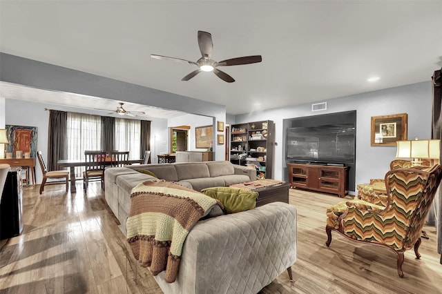1225 Oak Meadows Dr, Dallas, TX 75232 - living room with ceiling fan and light wood-style floors